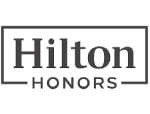 The image shows the Hilton Honors logo, featuring the words "Hilton Honors" in a rectangular box.