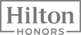 The image features the "Hilton Honors" logo, with the word "Hilton" in large font and "Honors" below it in smaller font, enclosed in a rectangle.
