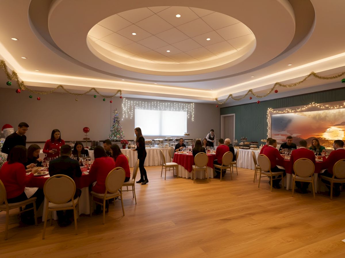 A festive gathering in a decorated room with tables, people dining, and Christmas decor like garlands and a Christmas tree.