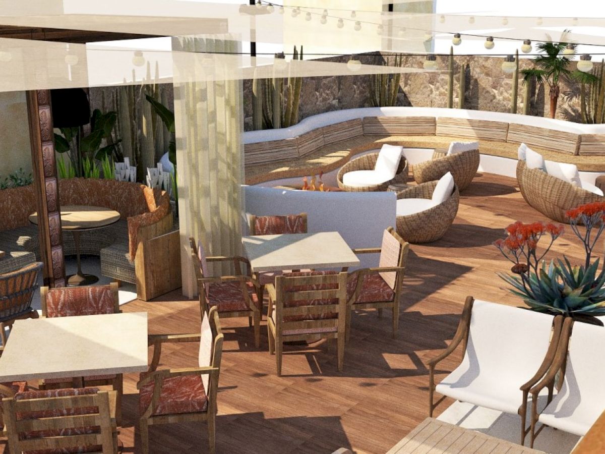An outdoor patio with wooden tables, chairs, and plants. Cozy seating areas include cushioned chairs and benches, under shade structures and string lights.